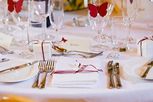 Table settings arranged for a wedding reception