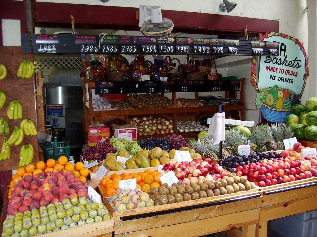 Fresh produce displayed at a farmers market stand