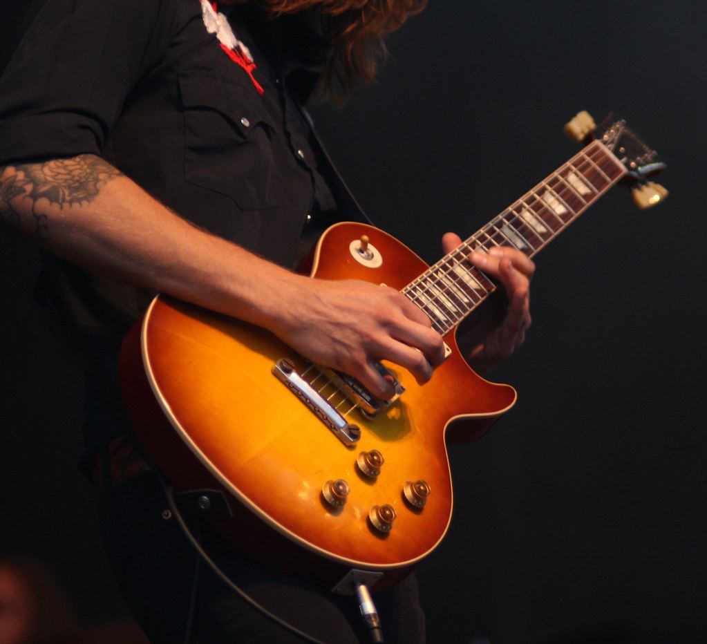 A musician performing live on an intimate stage